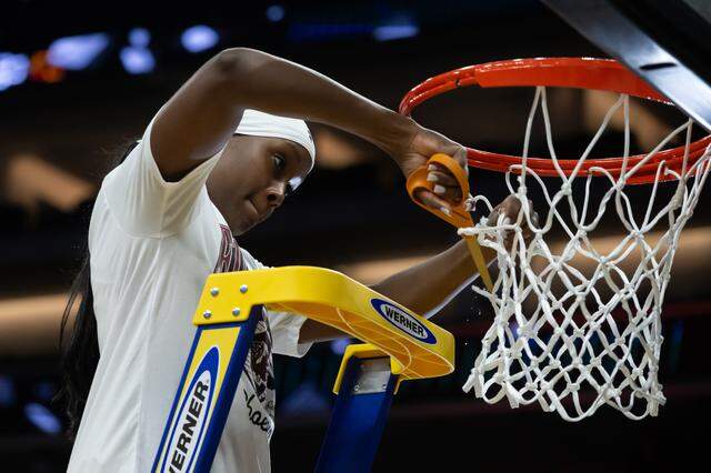 South Carolina Gamecocks guard Raven Johnson (25) cuts a piece of the net after her team beat the Texas Christian University Horned Frogs 78-52 during the NCAA Women’s Basketball Tournament Sweet 16 at Golden 1 Center in Sacramento on Monday, March 30, 2026.